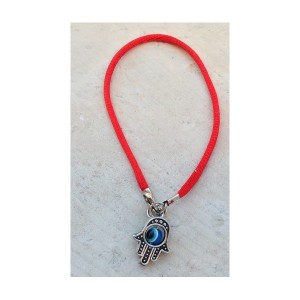 Red bracelet with Hamsa and eye against the evil eye