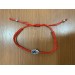 Red bracelet with Hamsa and eye against the evil eye